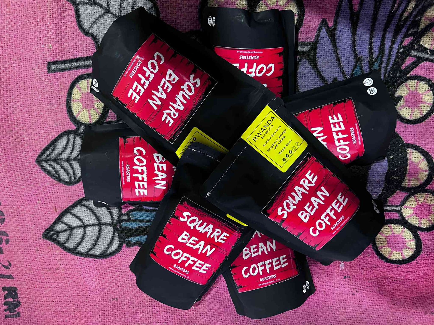 A range of Square Bean Coffee bags arranged in a circle.